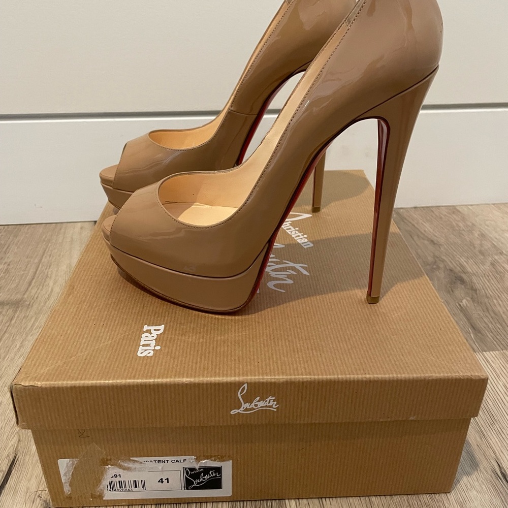 Size 41 Nude Christian Louboutin open toe heels.